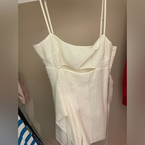 Super cute white romper! Size small! Never worn and is in great condition!